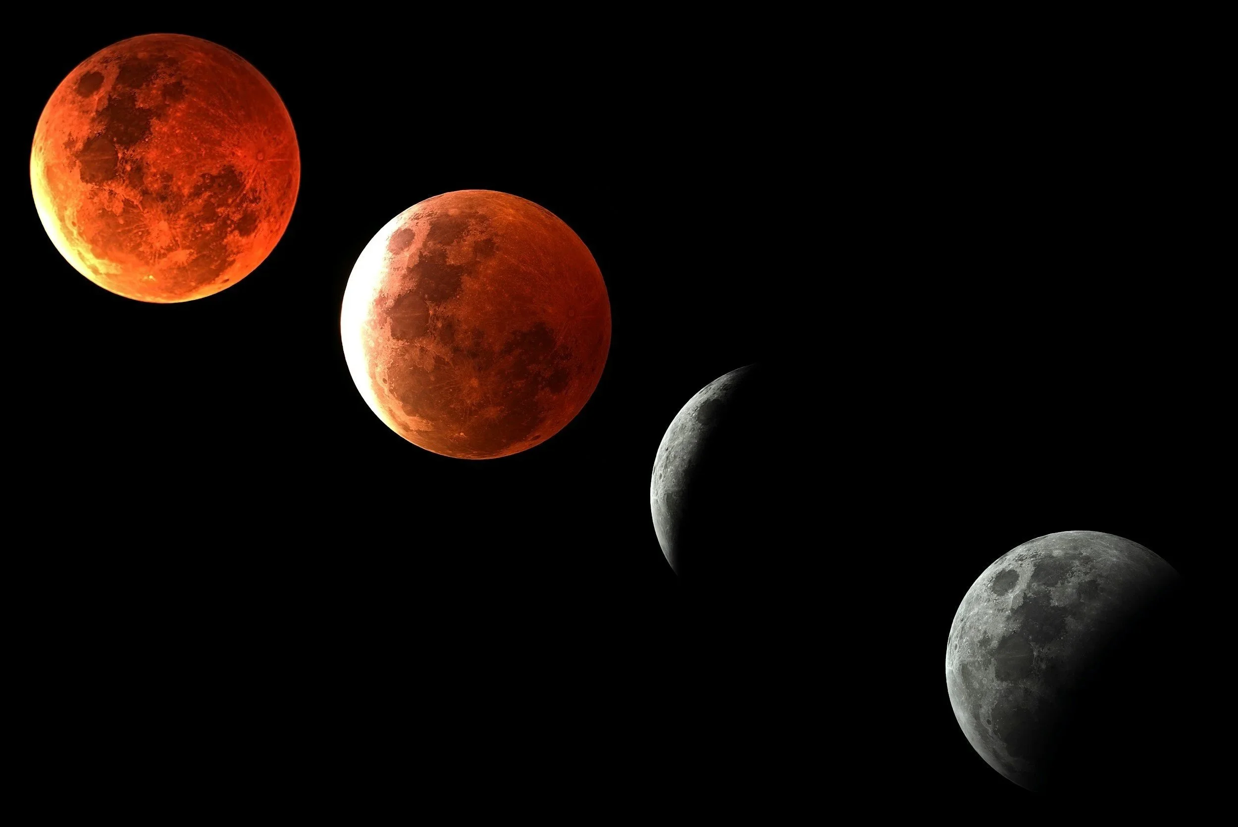 Four phases of the moon across a black night sky